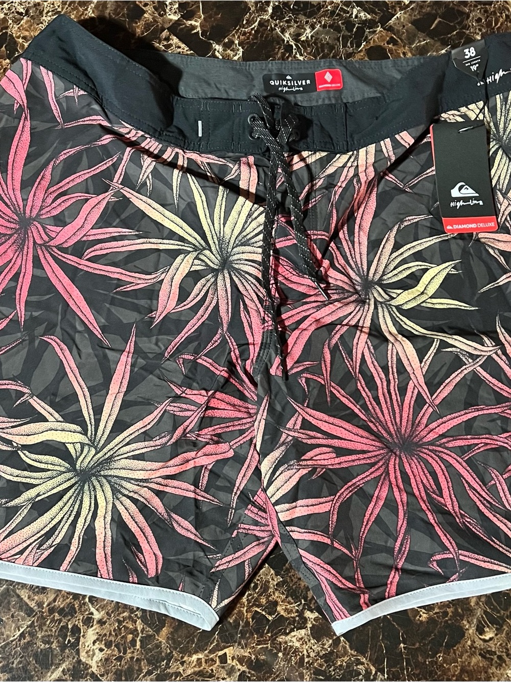 Quiksilver Men's Black Board Shorts with Pink & Yellow Floral Pattern
